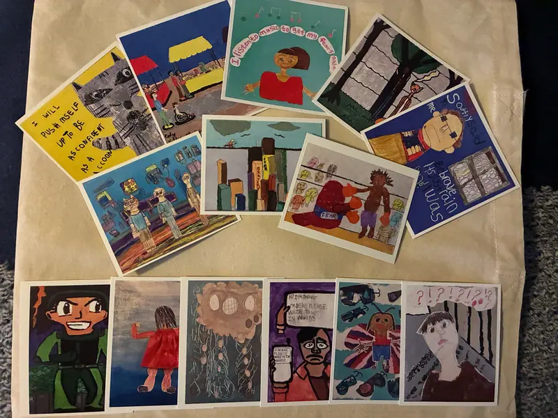 Paintings and drawings by artists with IDD laid out together.